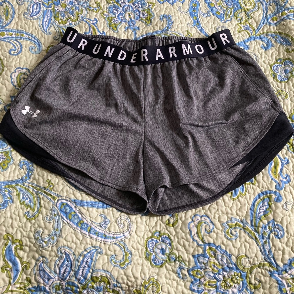 Medium Under Armour women’s gray shorts with pockets.